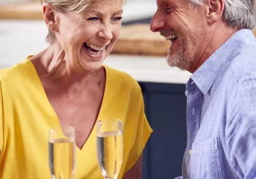 retired-couple-celebrating-with-glass-of-champagne-2021-09-08-23-39-22-utc
